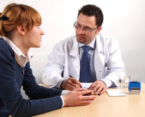 Patient speaking to a doctor about the Early Signs and Symptoms of Cancer