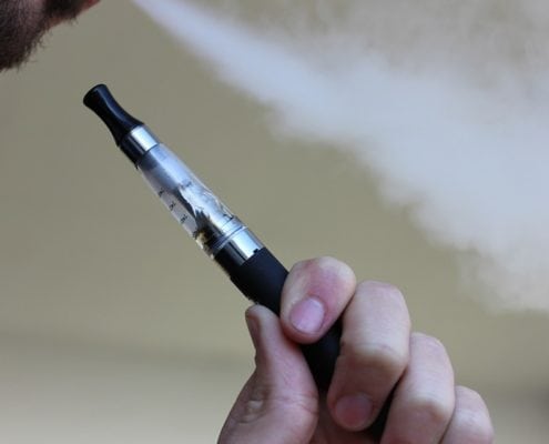 Man Smoking an E-Cgarette | Is There a Link Between Vaping and Lung Cancer? | SERO Blog